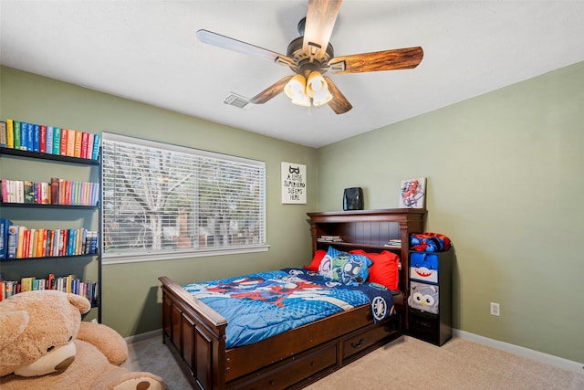 bedroom featuring light carpet and ceiling fan