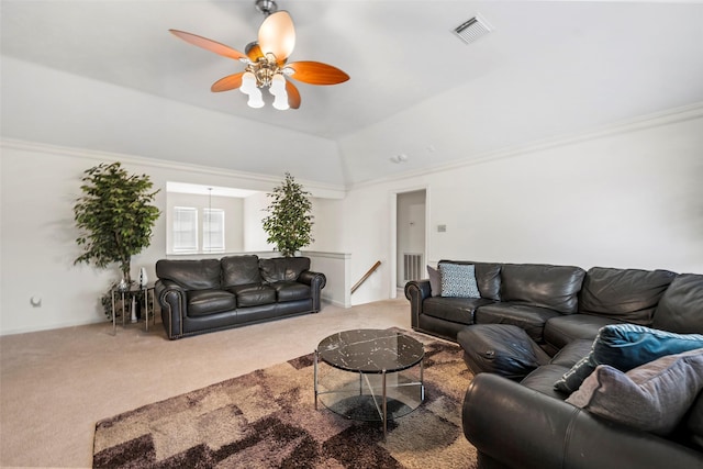 living room with crown molding, lofted ceiling, and carpet