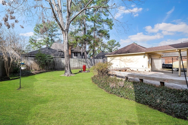 view of yard featuring a wooden deck