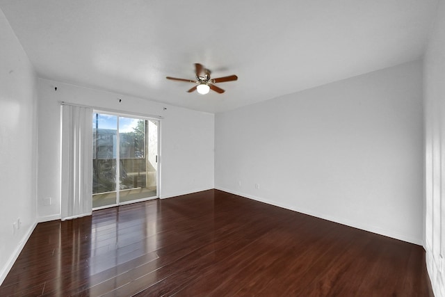 unfurnished room featuring ceiling fan and dark hardwood / wood-style floors