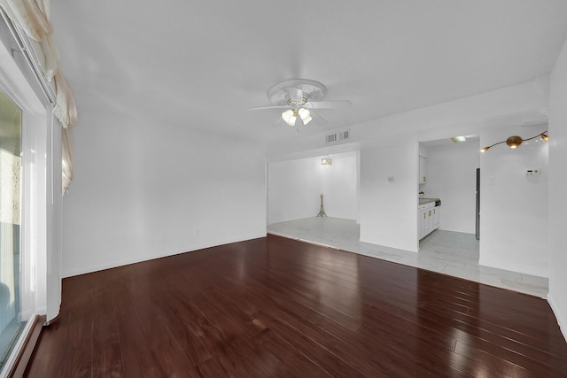 unfurnished living room featuring light hardwood / wood-style floors and ceiling fan