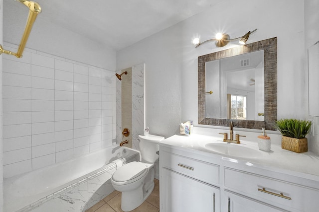 full bathroom with tile patterned floors, vanity, toilet, and tiled shower / bath