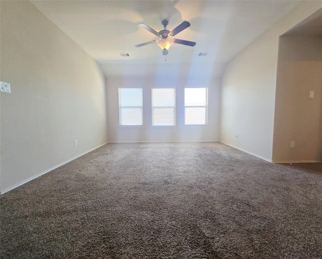 spare room featuring ceiling fan, lofted ceiling, and carpet floors