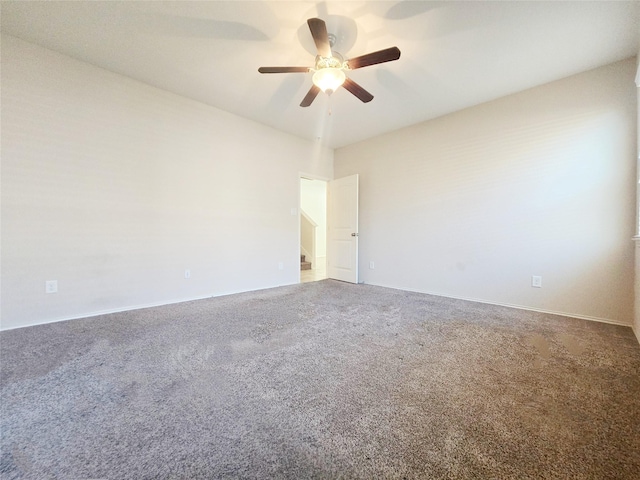 empty room with ceiling fan and carpet floors