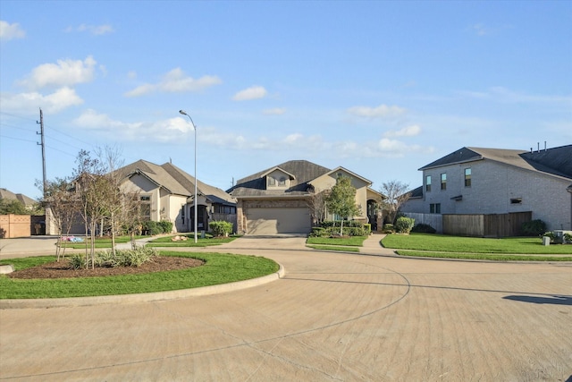 view of front facade featuring a garage and a front yard