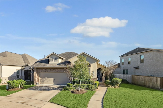 view of front facade with a garage and a front lawn