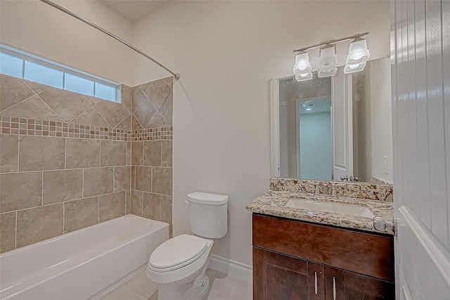 full bathroom with vanity, tile patterned flooring, tiled shower / bath, and toilet