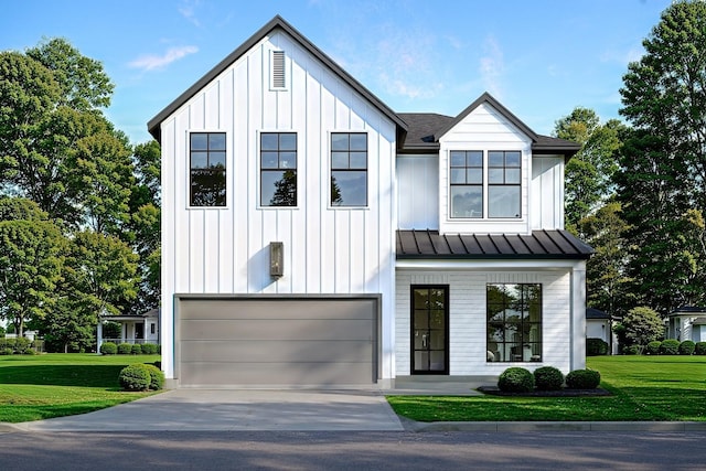 modern inspired farmhouse featuring a garage and a front lawn