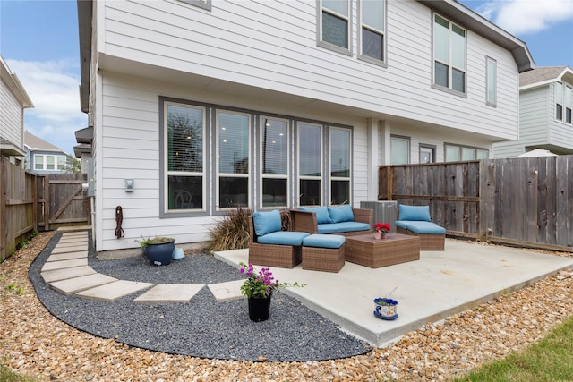 rear view of house featuring a patio area and an outdoor hangout area