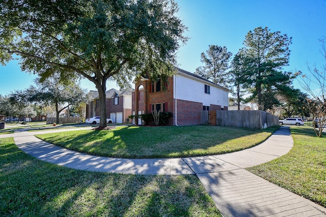 view of side of home with a yard