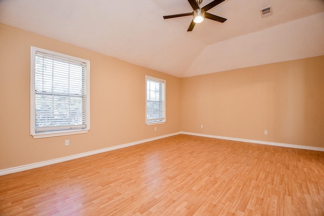 empty room with light hardwood / wood-style floors, ceiling fan, and lofted ceiling