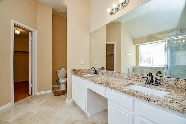 bathroom with vanity, toilet, an enclosed shower, and lofted ceiling