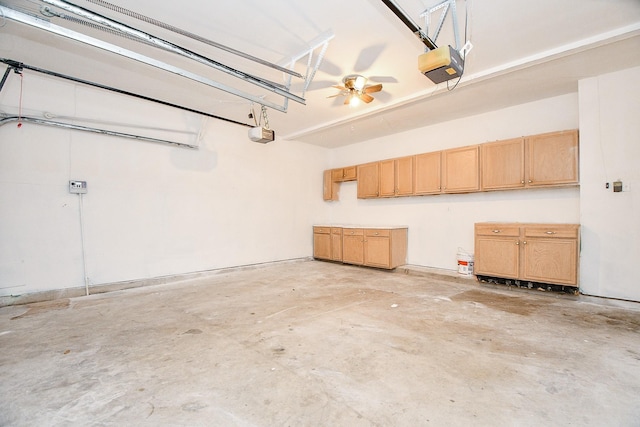 garage with ceiling fan and a garage door opener