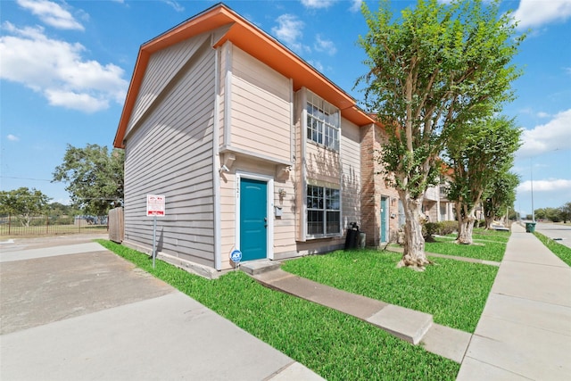 view of front of property with a front lawn