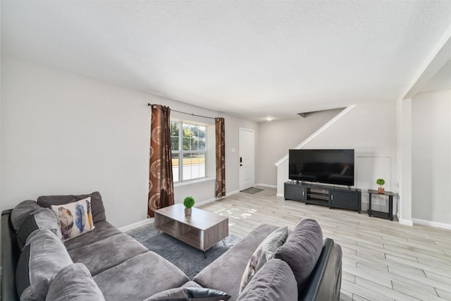 living room featuring a textured ceiling