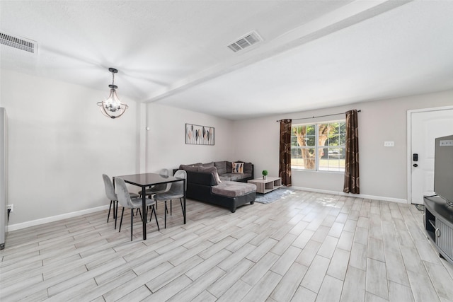 living room featuring an inviting chandelier