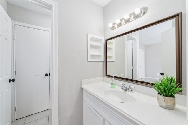 bathroom with tile patterned floors and vanity