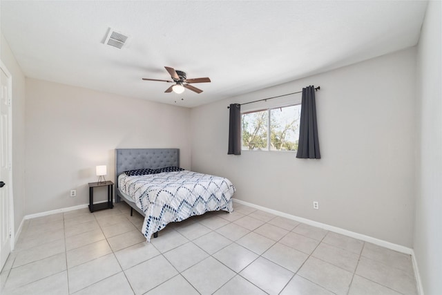 tiled bedroom with ceiling fan