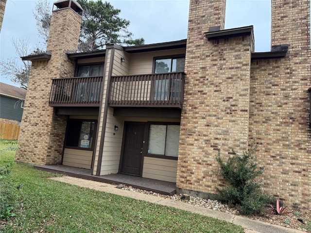 rear view of house with a balcony