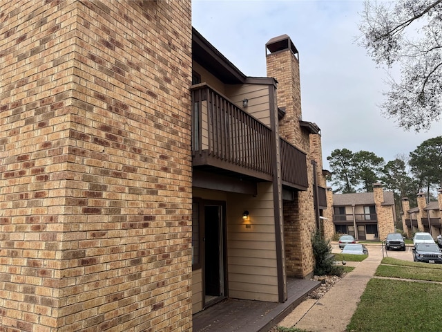 view of side of property featuring a balcony