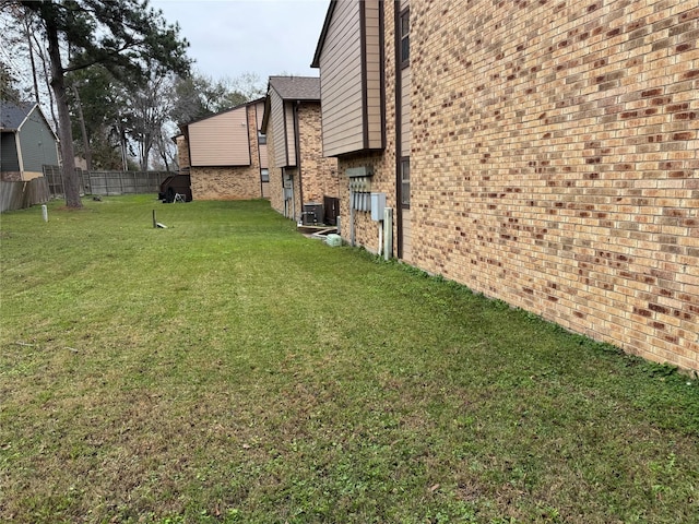 view of yard featuring central air condition unit