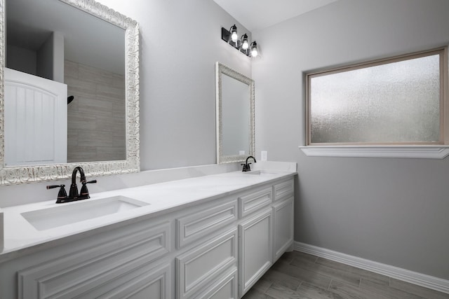 bathroom with vanity and walk in shower