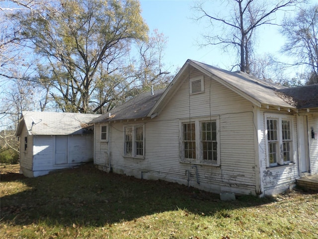 view of home's exterior featuring a lawn