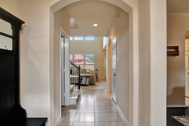 corridor featuring light tile patterned flooring