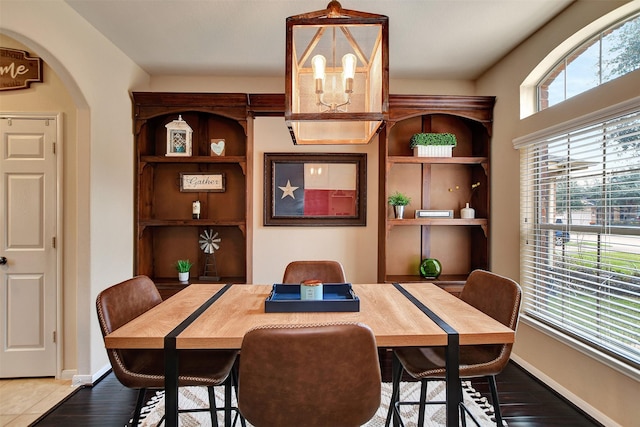 dining space with hardwood / wood-style floors