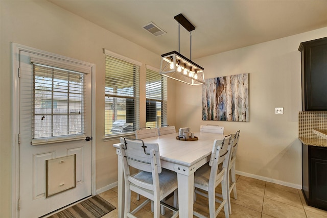 dining room with light tile patterned flooring