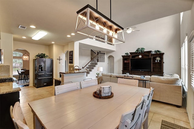 dining room featuring ceiling fan and light tile patterned floors