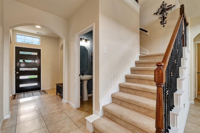 tiled foyer entrance with sink