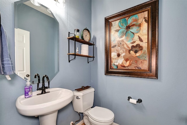 bathroom featuring sink and toilet