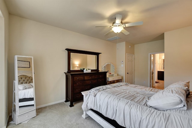 bedroom featuring connected bathroom, ceiling fan, and light colored carpet