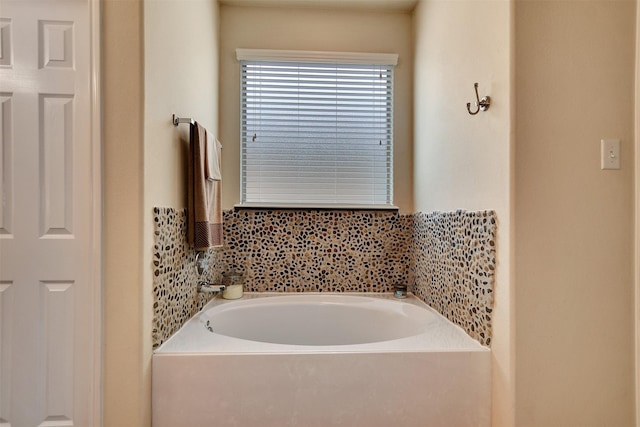 bathroom featuring a washtub