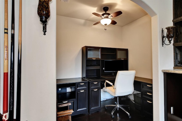 office area with dark hardwood / wood-style flooring, built in desk, and ceiling fan