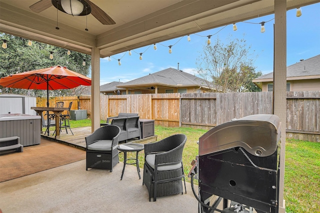 view of patio featuring grilling area, ceiling fan, and a deck