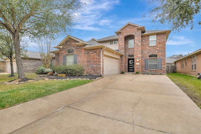 view of property featuring a garage and a front yard