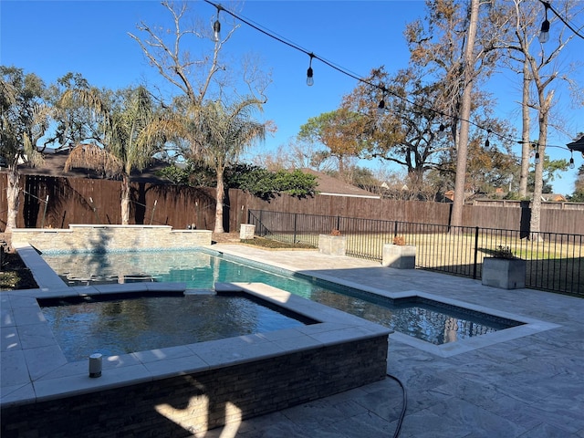 view of swimming pool with an in ground hot tub and a patio