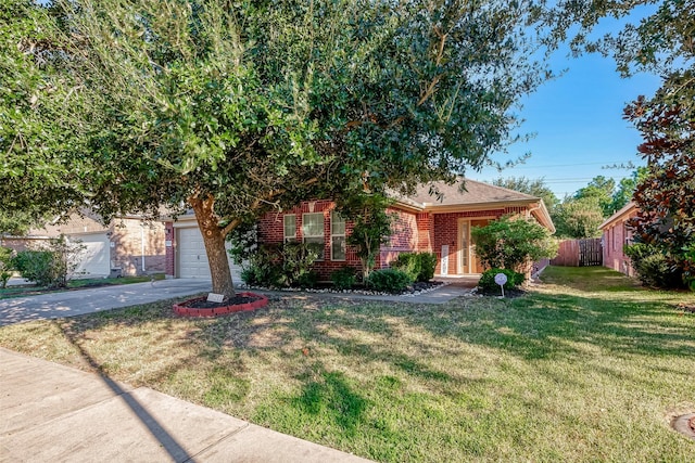 view of property hidden behind natural elements with a front lawn and a garage