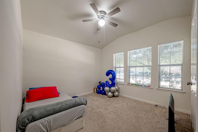 bedroom with carpet flooring, ceiling fan, and vaulted ceiling