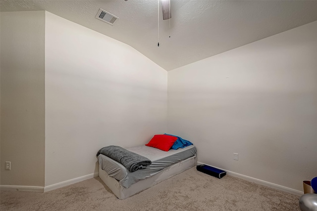 carpeted bedroom featuring ceiling fan and lofted ceiling