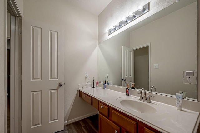 bathroom featuring hardwood / wood-style floors and vanity