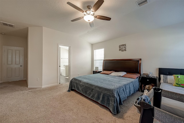 bedroom featuring ceiling fan, carpet, and ensuite bathroom