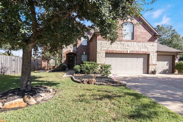 view of front property with a garage and a front lawn