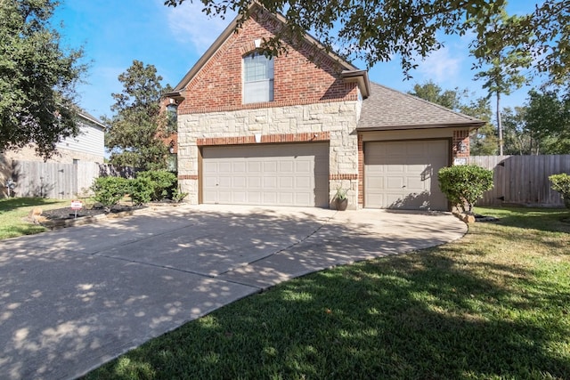 view of front property featuring a front lawn and a garage