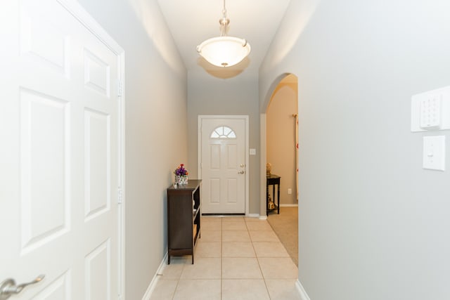 doorway featuring light tile patterned floors