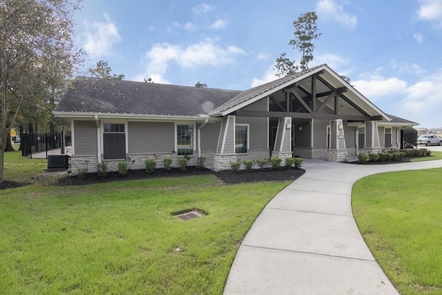 craftsman house with a front yard and covered porch