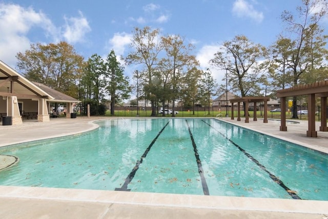 view of swimming pool with a patio area