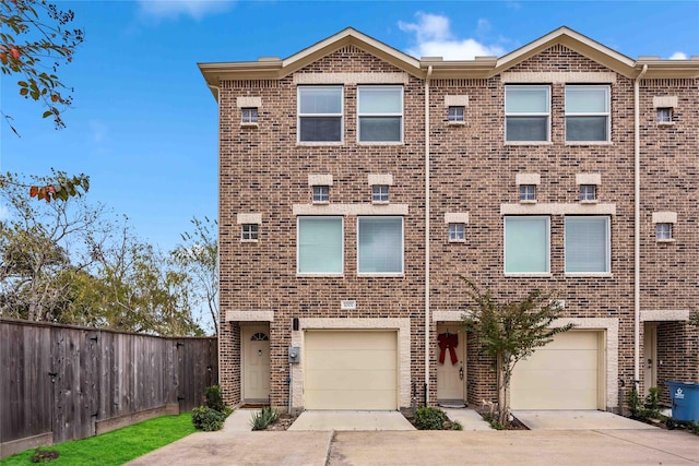 townhome / multi-family property featuring a garage